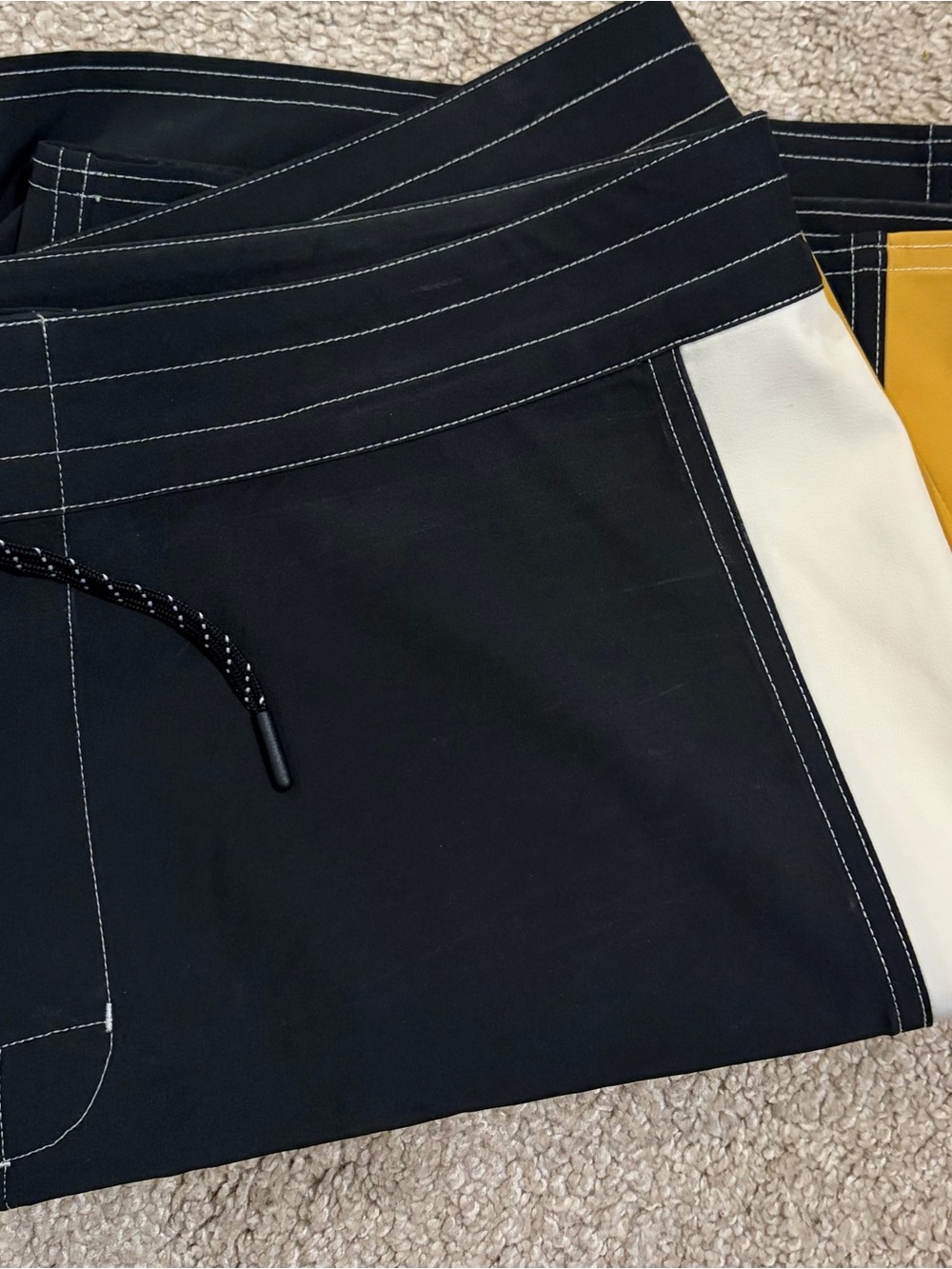 Birdwell Black Swim Shorts with White Stitching and Red Logo